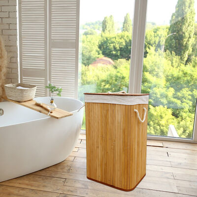 Natural bamboo laundry basket with cotton liner.